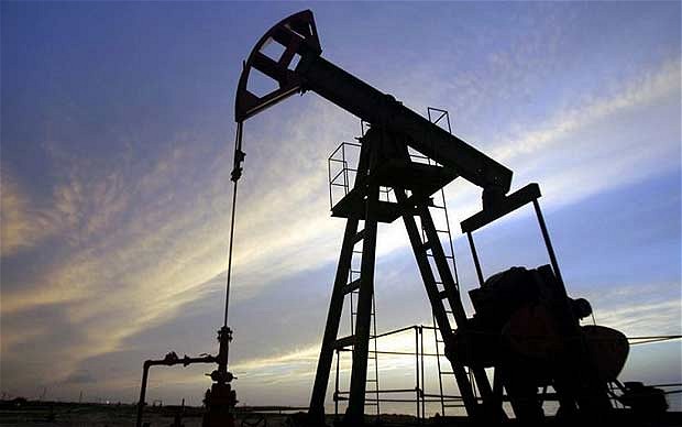 Oil Drops Toward $59 on Dollar, Stock Builds