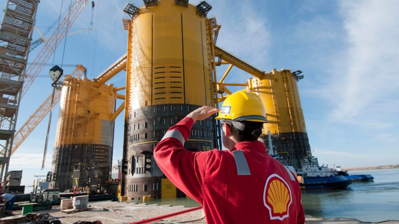 engineer-in-red-uniform-with-yellow-hard-hat-by-marsb-platform-construction.jpg